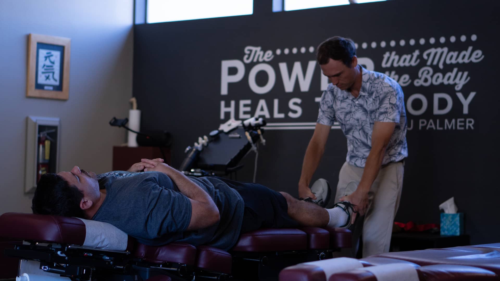Core chiropractic principle displayed on treatment room wall