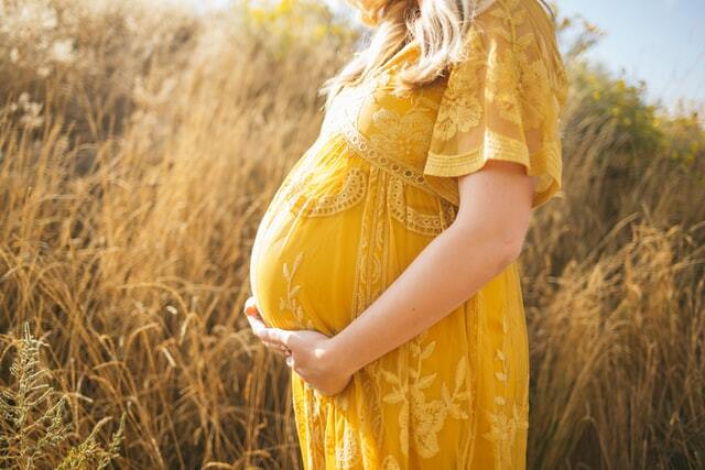 Expecting mother receiving gentle chiropractic care during pregnancy