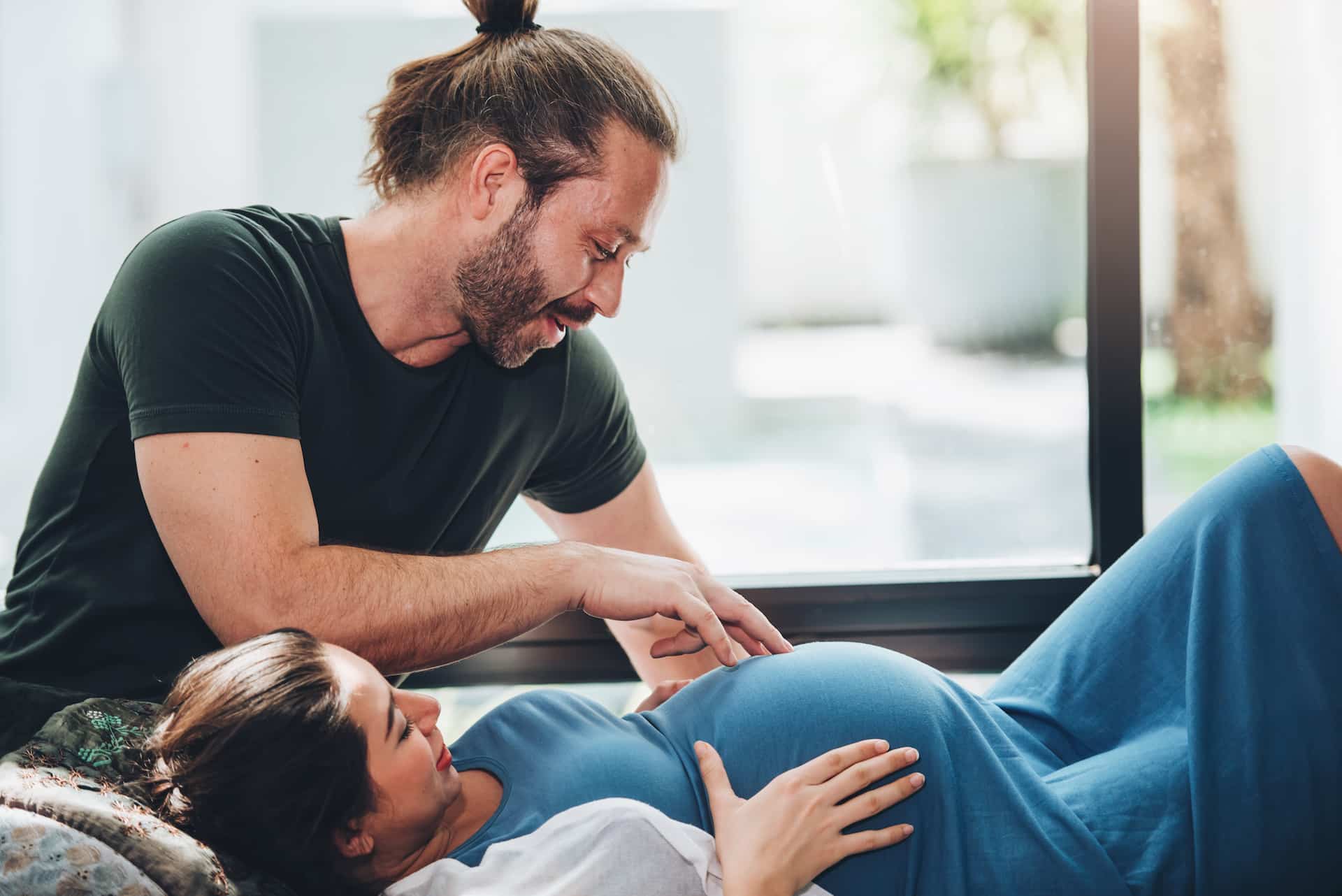Chiropractor providing gentle prenatal chiropractic care to a pregnant woman for back and pelvic support
