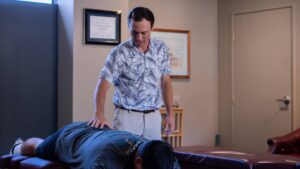 Dr. Riley Miller performing knee joint mobilization