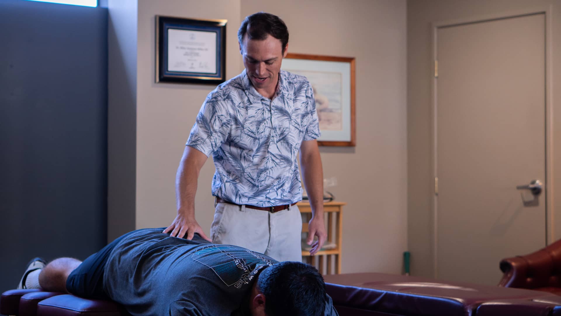 Dr. Riley Miller performing knee joint mobilization