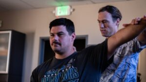 Patient performing guided shoulder rehab exercise