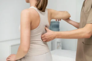 Person showing poor posture with neck and back strain