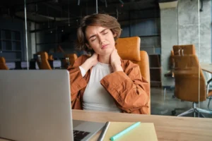 Woman experiencing neck pain from poor posture