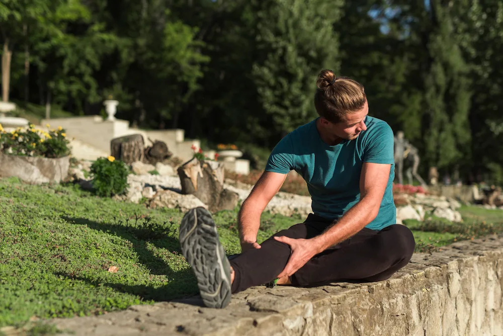 Active adult experiencing minor injury during outdoor summer recreation